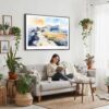 02 - Framed Guadalupe Mountains National Park Watercolor - Horizontal Canvas Print - Boho Living Room with Woman reading.jpg