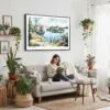 02 - Framed Isle Royale National Park Watercolor - Horizontal Canvas Print - Boho Living Room with Woman reading.jpg