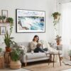 02 - Framed Niagara Falls Watercolor - Horizontal Canvas Print - Boho Living Room with Woman reading.jpg