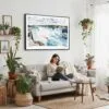 02 - Framed Niagara Falls Watercolor - Horizontal Canvas Print - Boho Living Room with Woman reading.jpg