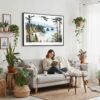 02 - Framed Olympic National Park Watercolor - Horizontal Canvas Print - Boho Living Room with Woman reading.jpg
