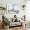02 - Framed Paris Eiffel Tower Watercolor Art - Horizontal Canvas Print - Boho Living Room with Woman reading.jpg