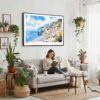 02 - Framed Positano Italy Watercolor Art - Horizontal Canvas Print - Boho Living Room with Woman reading.jpg