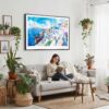 02 - Framed Santorini Blue Dome Church Watercolor Art - Horizontal Canvas Print - Boho Living Room with Woman reading.jpg