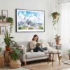 02 - Framed Seattle Skyline with Mount Rainier Watercolor Art - Horizontal Canvas Print - Boho Living Room with Woman reading.jpg