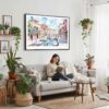 02 - Framed Venice Italy Canals Watercolor Art - Horizontal Canvas Print - Boho Living Room with Woman reading.jpg