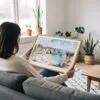 02 - A Woman Holding A Framed Portugal Algarve Watercolor - Horizontal Art Print.jpg