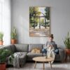 02 - Athes Georgia Arch Watercolor Canvas Print with Natural Floater Frame - Woman Knitting on grey couch - Vertical.jpg