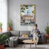02 - Belgrade Watercolor Canvas Print with Natural Floater Frame - Woman Knitting on grey couch - Vertical.jpg