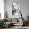 02 - Big Bend National Park Watercolor Canvas Print with Natural Floater Frame - Woman Knitting on grey couch - Vertical.jpg