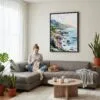02 - Framed Big Sur California Watercolor Canvas Print - Woman Knitting on grey couch - Vertical.jpg