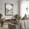 02 - Framed Morning Coffee in Amsterdam Watercolor Canvas Print - Woman reading in modern Living Room - Vertical.jpg
