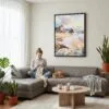 02 - Framed Oregon Coast Watercolor Canvas Print - Woman Knitting on grey couch - Vertical.jpg
