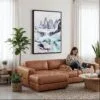 02 - Framed Patagonia Torres Del Paine Watercolor Canvas Print - Woman Knitting on leather couch - Vertical.jpg
