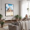 02 - Framed The Pyramids of Giza Watercolor Canvas Print - Woman reading in modern Living Room - Vertical.jpg