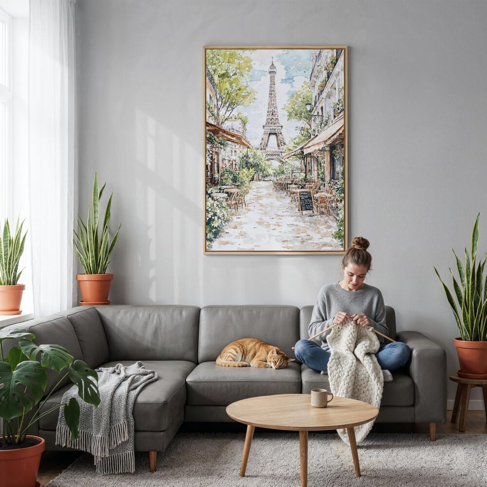 02 - Paris Cafe street scene with eiffel tower Watercolor Canvas Print with Natural Floater Frame - Woman Knitting on grey couch - Vertical.jpg 02 - Paris Cafe street scene with eiffel tower Watercolor Canvas Print with Natural Floater Frame - Woman Knitting on grey couch - Vertical.jpg