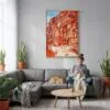 02 - Petra Jordan Watercolor Canvas Print with Natural Floater Frame - Woman Knitting on grey couch - Vertical.jpg