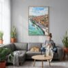 02 - Porto Skyline Watercolor Canvas Print with Natural Floater Frame - Woman Knitting on grey couch - Vertical.jpg