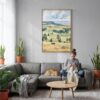 02 - Wind Cave National Park Watercolor Canvas Print with Natural Floater Frame - Woman Knitting on grey couch - Vertical.jpg