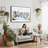 03 - 02 - Framed Prague Skyline Watercolor - Horizontal Canvas Print - Boho Living Room with Woman reading.jpg