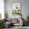 03 - Balboa Park California Tower Watercolor Canvas Print with Natural Floater Frame - Woman Knitting on grey couch - Vertical.jpg