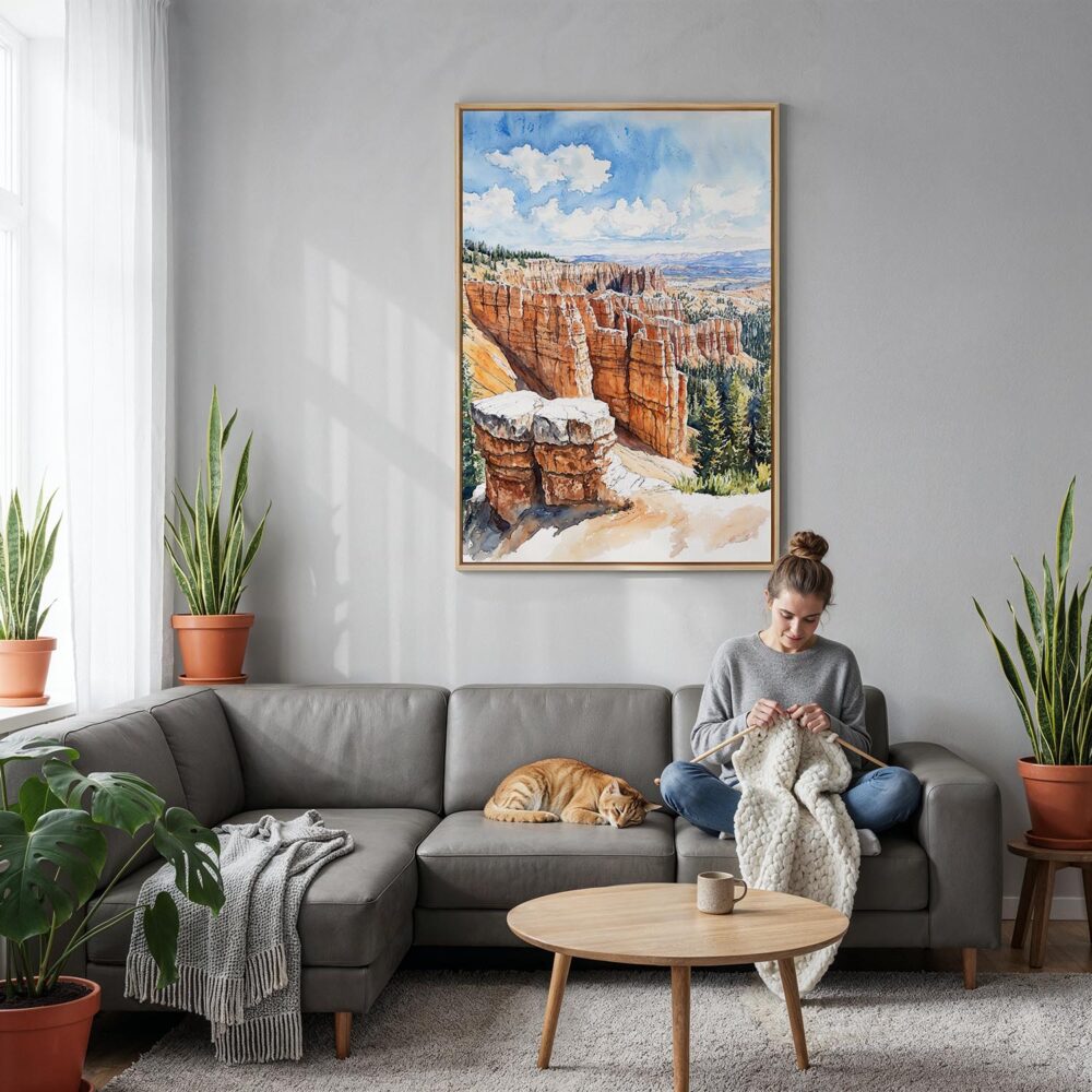 03 - Bryce Canyon Watercolor Canvas Print with Natural Floater Frame - Woman Knitting on grey couch - Vertical.jpg 03 - Bryce Canyon Watercolor Canvas Print with Natural Floater Frame - Woman Knitting on grey couch - Vertical.jpg