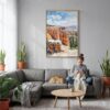 03 - Bryce Canyon Watercolor Canvas Print with Natural Floater Frame - Woman Knitting on grey couch - Vertical.jpg