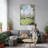 03 - Central Park New York Watercolor Canvas Print with Natural Floater Frame - Woman Knitting on grey couch - Vertical.jpg
