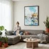 03 - Framed Amritsar Golden Temple Watercolor Canvas Print - Woman Knitting on grey couch - Vertical.jpg