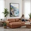 03 - Framed Big Sur California Watercolor Canvas Print - Woman Knitting on leather couch - Vertical.jpg