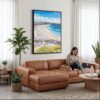 03 - Framed Bondi Beach Watercolor Canvas Print - Woman Knitting on leather couch - Vertical.jpg