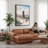 03 - Framed Brisbane Skyline Watercolor Canvas Print - Woman Knitting on leather couch - Vertical.jpg