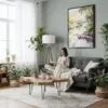 03 - Framed Floride Everglades Watercolor Canvas Print - Woman reading in Boho Living Room - Vertical.jpg