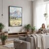 03 - Framed Grand Teton Watercolor Canvas Print - Woman reading in modern Living Room - Vertical.jpg