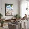 03 - Framed Morning Coffee in Lisbon Watercolor Canvas Print - Woman reading in modern Living Room - Vertical.jpg