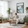 03 - Framed Niagara Falls Watercolor Canvas Print - Woman reading on couch - Vertical.jpg