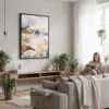 03 - Framed Oregon Coast Watercolor Canvas Print - Woman reading in modern Living Room - Vertical.jpg