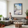 03 - Framed Santa Monica Watercolor Canvas Print - Woman Knitting on grey couch - Vertical.jpg