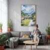 03 - Grindelwald Switzerland Watercolor Canvas Print with Natural Floater Frame - Woman Knitting on grey couch - Vertical.jpg