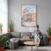 03 - Rome Colosseum Watercolor Canvas Print with Natural Floater Frame - Woman Knitting on grey couch - Vertical.jpg