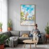 03 - San Salvador Watercolor Canvas Print with Natural Floater Frame - Woman Knitting on grey couch - Vertical.jpg