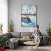 03 - St Louis Watercolor Canvas Print with Natural Floater Frame - Woman Knitting on grey couch - Vertical.jpg