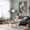 04 - Framed Carlsbad Caverns Watercolor Canvas Print - Woman reading in Boho Living Room - Vertical.jpg