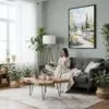 04 - Framed Fairbanks Alaska Watercolor Canvas Print - Woman reading in Boho Living Room - Vertical.jpg