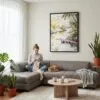 04 - Framed Floride Everglades Watercolor Canvas Print - Woman Knitting on grey couch - Vertical.jpg