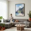 04 - Framed Hawaii - Nā Pali Watercolor Canvas Print - Woman Knitting on grey couch - Vertical.jpg