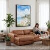 04 - Framed Laguna Beach Watercolor Canvas Print - Woman Knitting on leather couch - Vertical.jpg
