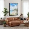 04 - Framed Laguna Beach Watercolor Canvas Print - Woman Knitting on leather couch - Vertical.jpg