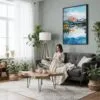 04 - Framed Lake Clark National Park Watercolor Canvas Print - Woman reading in Boho Living Room - Vertical.jpg