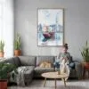 04 - Hong Kong Watercolor Canvas Print with Natural Floater Frame - Woman Knitting on grey couch - Vertical.jpg